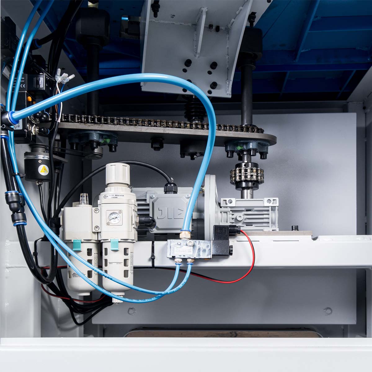 Adhesive and feed roller drive